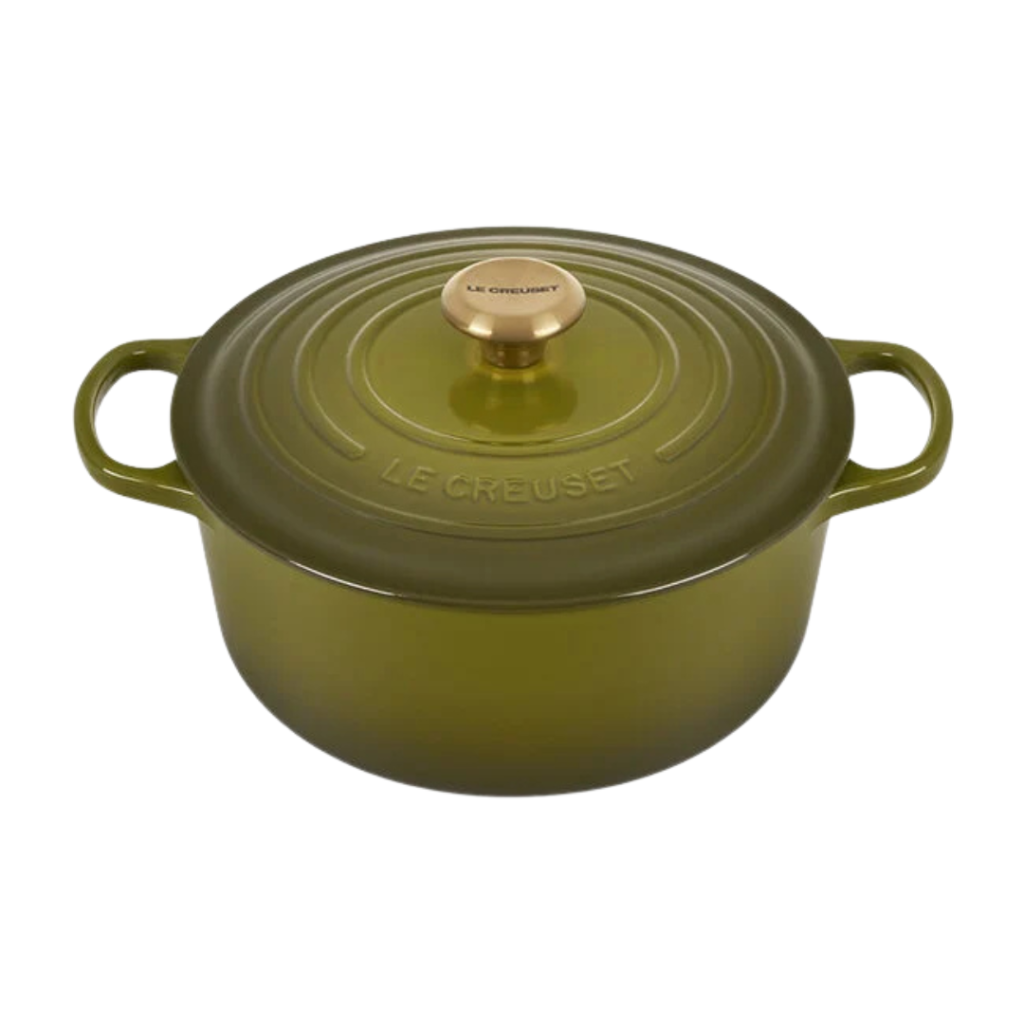 Olive green Le Creuset Dutch oven with gold knob, ideal for slow cooking and baking.